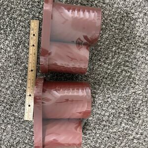 2- sets of 2 maroon bathroom plastic canisters